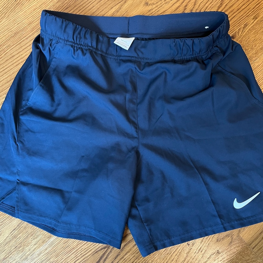 Navy Nike athletic shorts.  Unlined with pockets